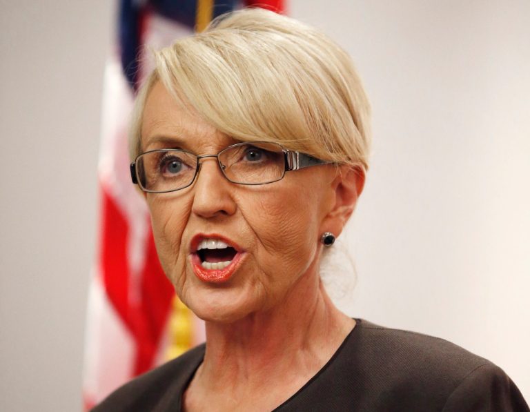 Arizona Republican Gov. Jan Brewer speaks at a news conference at the Arizona Capitol in Phoenix. Brewer said Wednesday, March 12, 2014 that she won't seek a third term in office. The U.S. Supreme Court on Monday refused to hear an appeal of a blocked provision of Arizona's 2010 immigration enforcement law, dealing another blow to Gov. Jan Brewer in her effort to defend the law. The court declined to review the ruling that barred police from arresting people who harbor those living in the United States illegally. (AP Photo/Ross D. Franklin, File)