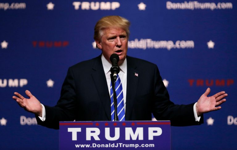 Republican presidential candidate Donald Trump gestures during a campaign stop at Winnacunnet High School in Hampton, N.H., Friday, Aug. 14, 2015. (AP Photo/Charles Krupa)