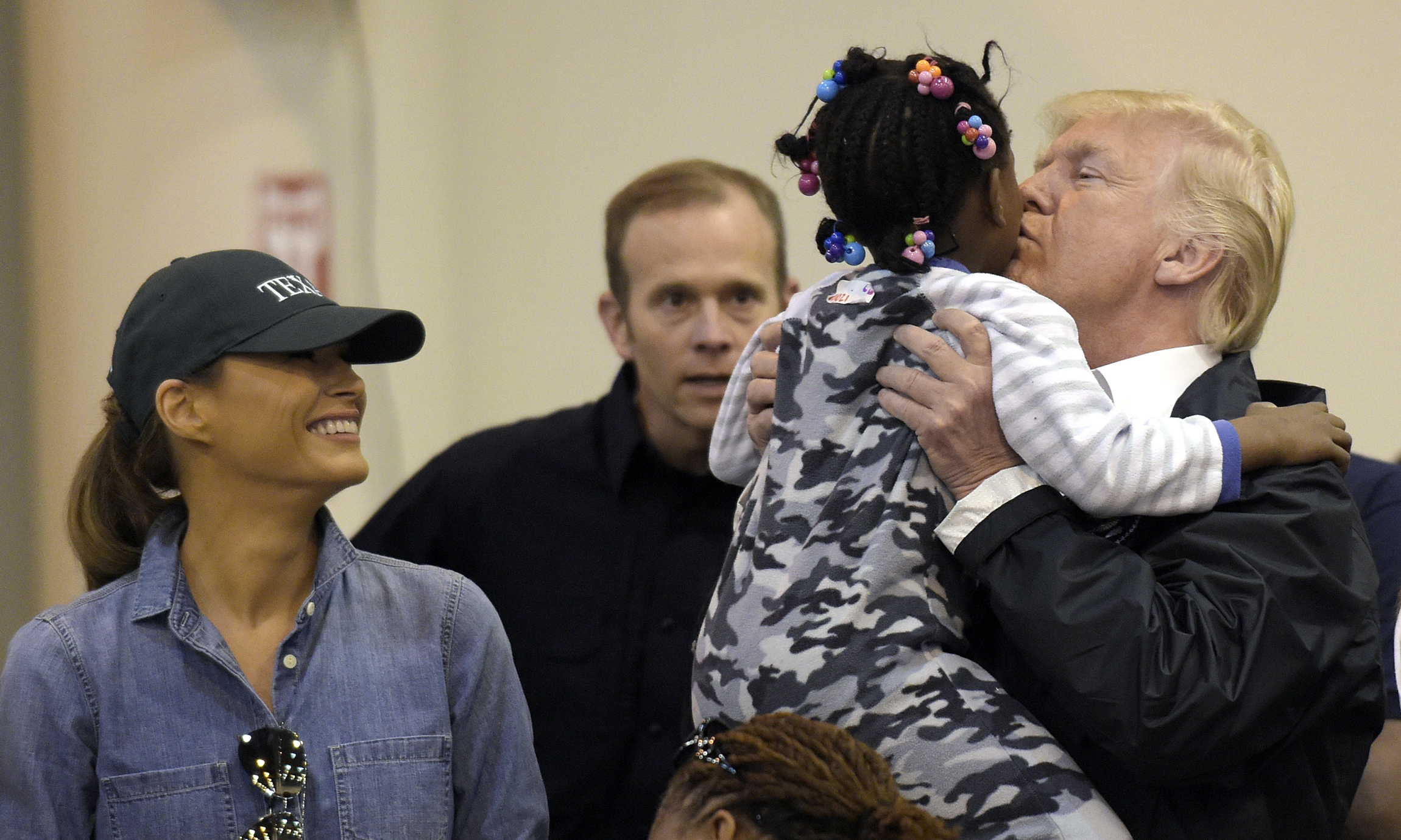 Trump acts as consoler-in-chief to Harvey victims while staying focused on North Korea threat