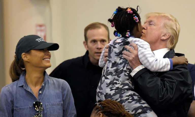 President Trump, alongside his wife Melania, and members of his Cabinet, greeted, consoled, took selfies with, and even doled out supplies to victims of the storm in Houston. (AP Photo/Susan Walsh)