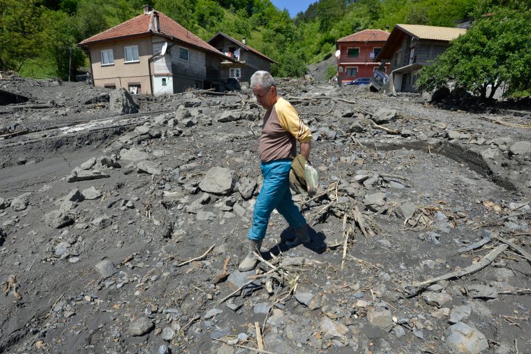 Ramiz Skopljak, 65, walks where his house once stood and was swept by the river last week in the village of Topcic Polje, near the Bosnian town of Zenica, 90 kilometers north of Sarajevo, on Monday May 19, 2014. At least 35 people have died in Serbia and Bosnia in the five days of flooding caused by unprecedented torrential rain, laying waste to entire towns and villages and sending tens of thousands of people out of their homes, authorities said. (AP Photo/Sulejman Omerbasic)
