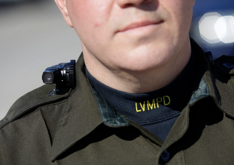 Las Vegas police Sgt. Peter Ferranti models a body camera Wednesday, Nov. 12, 2014, in Las Vegas. The camera is the same type now being used by about 200 street officers in Las Vegas. (AP Photo/John Locher)