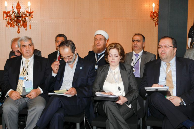   Moaz al-Khatib, head of a new coalition of Syrian opposition groups, 2nd left, and Syrian delegation attend a meeting of the Friends of the Syrian People in Marrakech, Morocco, Wednesday Dec. 12, 2012. The Syrian opposition called for 