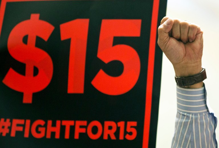 The new minimum wage will increase prices, decrease employment and shrink the economy. (AP Photo/Mike Groll)