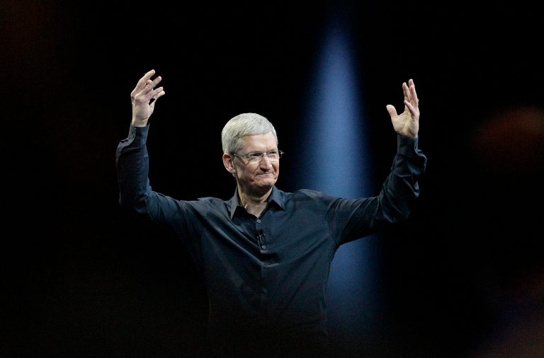 FILE - In this June 2, 2014 file photo, Apple CEO Tim Cook gestures during the Apple Worldwide Developers Conference in San Francisco. Apple's stock touched a new high Wednesday, Aug. 20, 2014, reflecting investors' renewed faith in Cook's ability to outwit the competition and expand the technological hit factory built by the late Steve Jobs. (AP Photo/Jeff Chiu, File)
