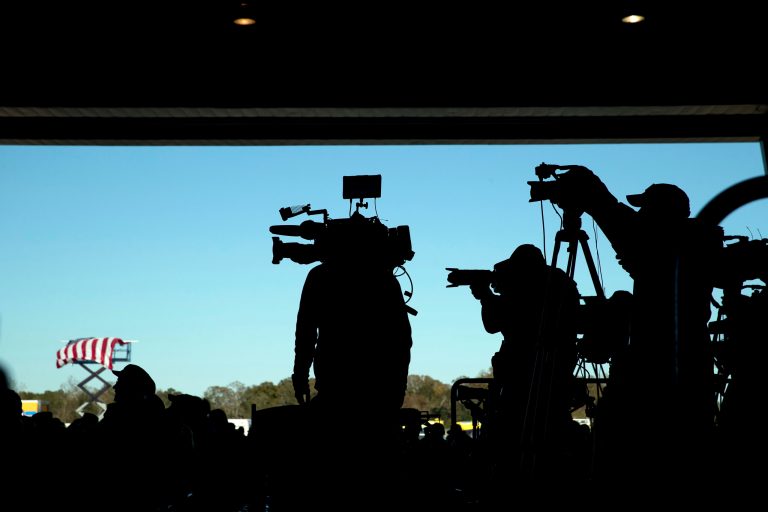 Members of the media stand on a back riser as President-elect Donald Trump speaks at a rally in a DOW Chemical Hanger at Baton Rouge Metropolitan Airport, Friday, Dec. 9, 2016, in Baton Rouge, La. (AP Photo/Andrew Harnik)