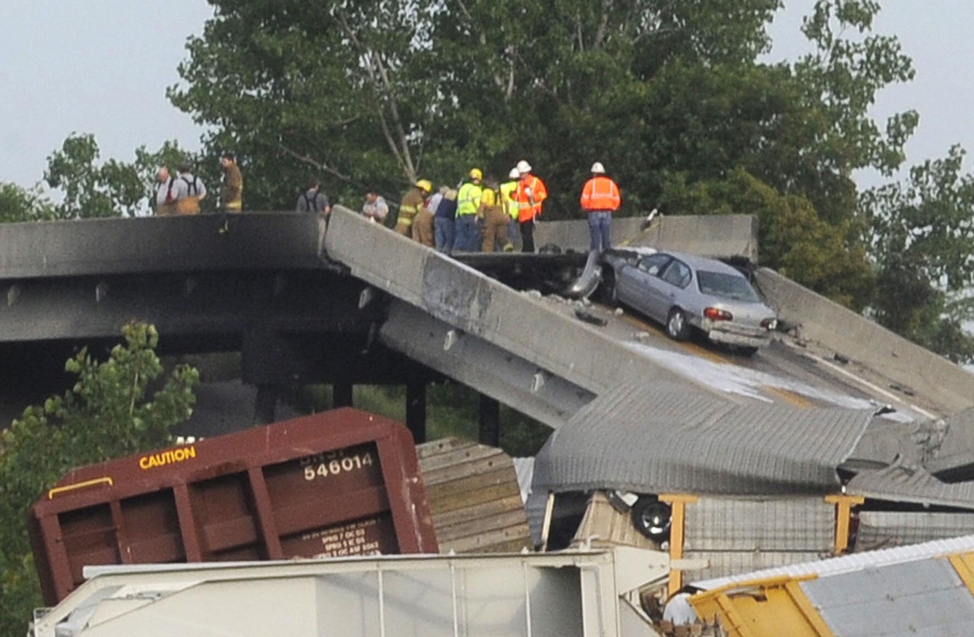 Missouri highway buckles after rail cars hit overpass