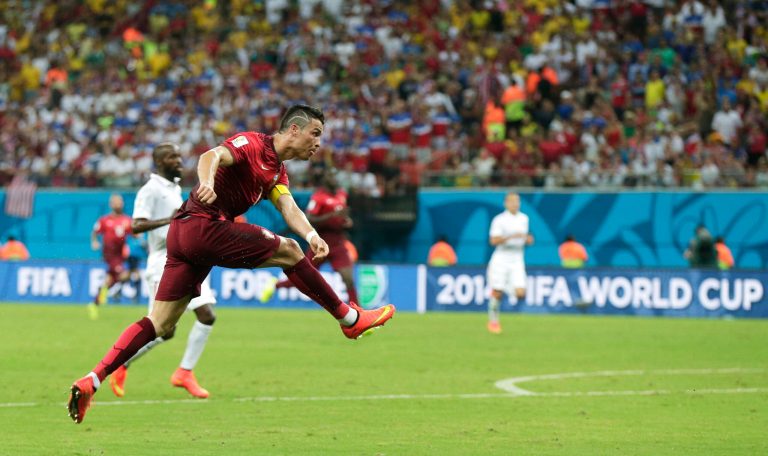 Portugal's Cristiano Ronaldo takes a shot during the group G World Cup soccer match between the United States and Portugal at the Arena da Amazonia in Manaus, Brazil, Sunday, June 22, 2014. (AP Photo/Marcio Jose Sanchez)