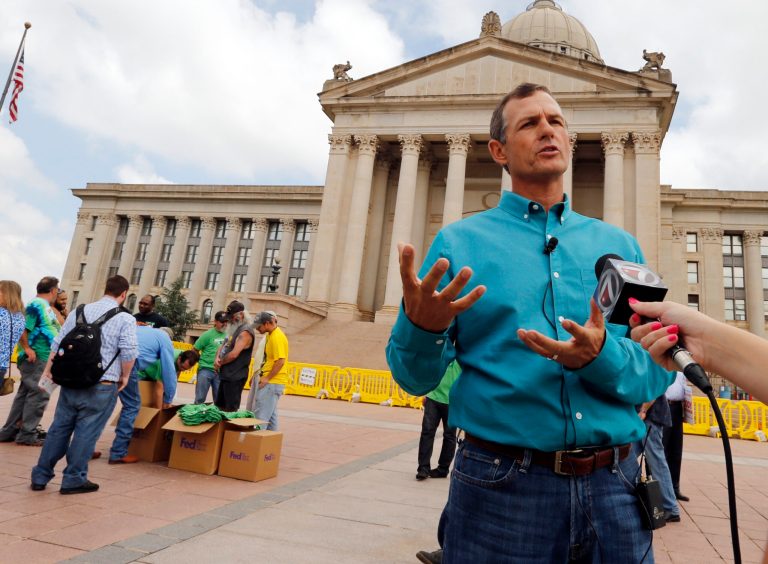 Chip Paul, chairman Oklahomans for Health, speaks with the media during a medical marijuana rally at the State Capitol on May 28, 2014 in Oklahoma City, Okla. The rally is formal launch of a signature drive to get a medical marijuana measure on a statewide ballot.  (AP Photo/The Oklahoman, Steve Sisney)