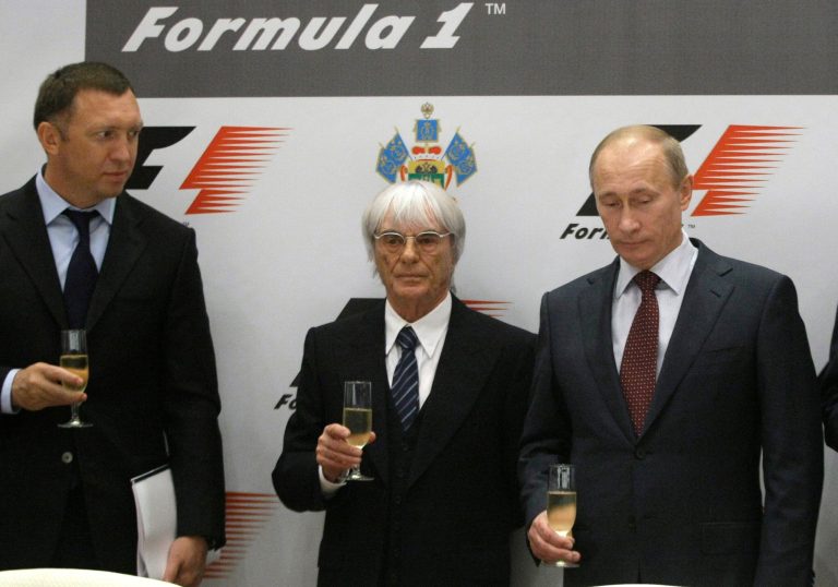In this Thursday, Oct. 14, 2010 file photo, then, Russian Prime Minister Vladimir Putin, second right, Formula One chief Bernie Ecclestone, second left, and Oleg Deripaska, toast after a signing ceremony in the Black Sea resort of Sochi, southern Russia. Oleg Deripaska's Basic Element, insists its projects were all designed to be profitable. The company is building an Olympic village and a seaport and has just finished revamping the Sochi airport, for a combined cost of $1.4 billion.