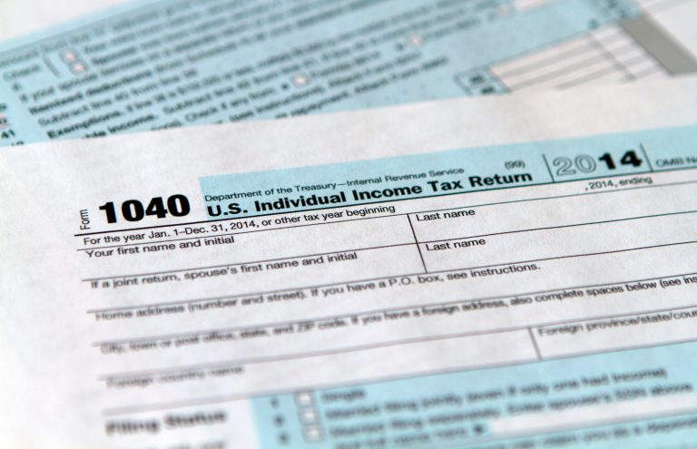 The Internal Revenue Service tax form 1040 for 2014. (AP Photo/Jon Elswick)