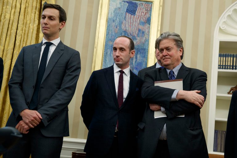 From left, Senior Adviser Jared Kushner, policy adviser Stephen Miller, and chief strategist Steve Bannon watches as President Donald Trump signs an executive order to withdraw the U.S. from the 12-nation Trans-Pacific Partnership trade pact agreed to under the Obama administration, Monday, Jan. 23, 2017, in the Oval Office of the White House in Washington. (AP Photo/Evan Vucci)