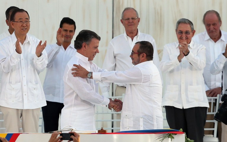 Colombian President Juan Manuel Santos and the Revolutionary Armed Forces of Colombia commander Rodrigo 
