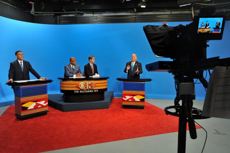 Maryland Democratic gubernatorial candidate, Lt. Gov. Anthony Brown, left, and Republican candidate Larry Hogan, right, spar during their first gubernatorial debate in Baltimore, Tuesday, Oct. 7, 2014. Also pictured are moderators, WJZ television anchor Vic Carter, second from left, and Baltimore Sun editorial page editor Andrew Green. (AP Photo/The Baltimore Sun, Amy Davis, Pool)