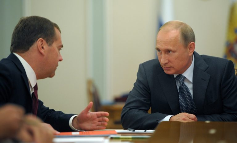 Russian President Vladimir Putin listens to Russian Prime Minister Dmitry Medvedev, left, during the Security Council meeting in the Novo-Ogaryovo residence, outside Moscow, Russia, Monday, Sept. 15, 2014.(AP Photo/RIA Novosti, Alexei Druzhinin, Presidential Press Service)