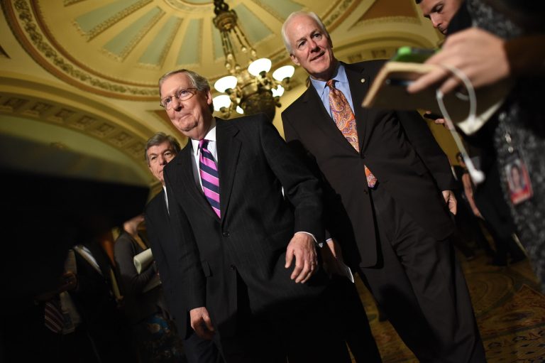 Senate Minority Leader Mitch McConnell (center) , R-K.Y., Â arrives with members of the Republican senate leadership including Sen. John Cornyn (right), R-Tex., and Sen. Roy Blunt, R-Mo., following the weekly Republican policy luncheon at the U.S. Capitol Nov. 18, 2014 in Washington, DC. (Photo by Win McNamee/Getty images)