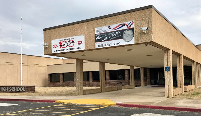 In this Feb. 24, 2018 photo, the main entrance of Dalton High School is shown, in Dalton, Ga. Dalton police tweeted that 53-year-old Jesse Randall Davidson has been taken into custody after a 30- to 45-minute standoff with police. (AP Photo/Jeff Martin)