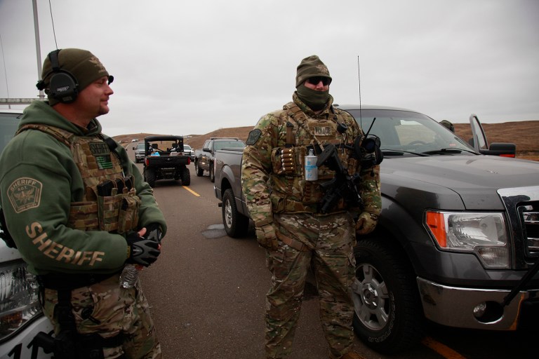 Police say concussion grenades weren't used in the encounter. (AP Photo/John L. Mone)