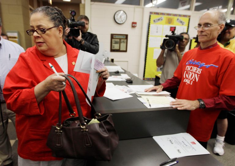   In this June 6, 2012 photo, Chicago Teachers Union President Karen Lewis casts her ballot during a strike authorization vote at a Chicago high school. Angered by Mayor Rahm Emanuelâs call for a longer school day and wage and benefit concessions, 25,000 Chicago teachers voted this week to consider authorizing their first strike in a quarter-century. (AP Photo/M. Spencer Green)  