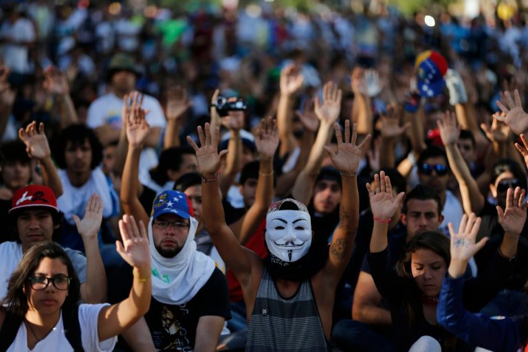Demonstrators are protesting the Wednesday killings of two university students who were shot in different incidents after an anti-government protest demanding the release of student protesters arrested in various parts of Venezuela.(AP Photo/Fernando Llano)
