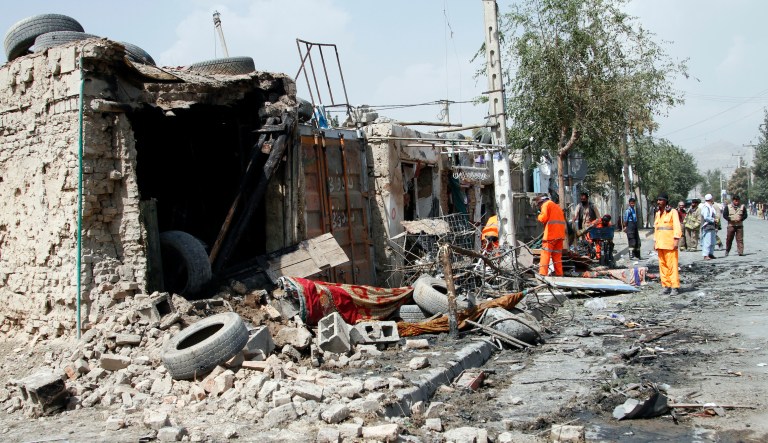 Afghan municipality workers clear debris after an explosion in Kabul, Afghanistan, Wednesday, Sept. 9, 2020. Spokesman for Afghanistan's Interior Ministry said the bombing that targeted the convoy of the country's first vice president on Wednesday morning killed several people and wounded more than a dozen others, including several of the vice president's bodyguards.