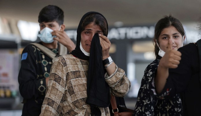 Afghan refugees arrive.
