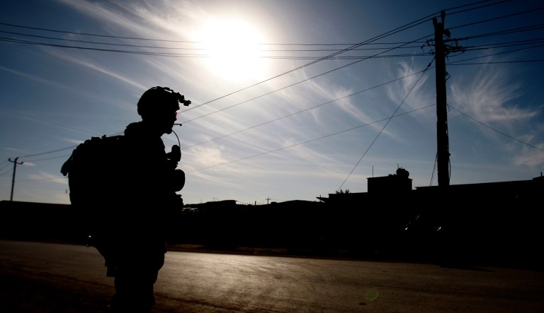 In this Jan. 18, 2010 photo, a soldier from the Canadian Army Reservists attached to Princess Patricia's Canadian Light Infantry is seen silhouetted as his unit carry out an information gathering patrol in Kandahar City, southern Afghanistan. If the push to electrify Kandahar City succeeds, the potential payoff is great. It would mean lights in the streets at night, access to news broadcasts and the opportunity to grow Kandahar into a manufacturing hub that can compete with neighboring Pakistan.