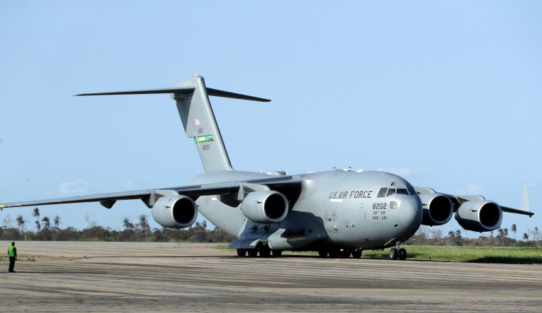 The Boeing C-17 Globemaster III US Airforce military transport aircraft arrives at the airport in Beira, Mozambique, Thursday, March 28, 2019. The first cases of cholera have been confirmed in the cyclone-ravaged city of Beira, Mozambican authorities announced on Wednesday, raising the stakes in an already desperate fight to help hundreds of thousands of people sheltering in increasingly squalid conditions.