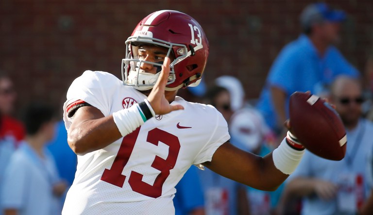 Alabama quarterback Tua Tagovailoa (13) works on passing drills during warmups for their NCAA college football game against Mississippi on Saturday, Sept. 15, 2018, in Oxford, Miss. Alabama won 62-7.