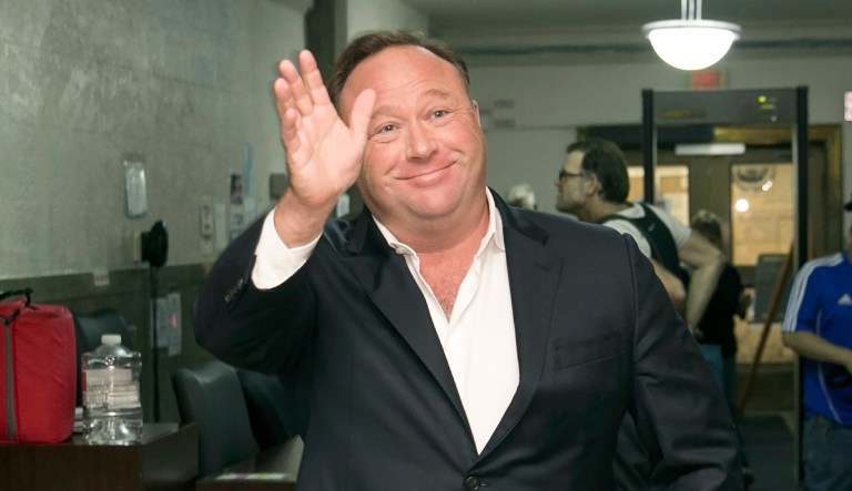 FILE - In this Wednesday, April 19, 2017, file photo, Alex Jones, a right-wing radio host and conspiracy theorist, arrives for a child custody trial at the Heman Marion Sweatt Travis County Courthouse in Austin, Texas. The music streaming service Spotify says it has removed some episodes of âThe Alex Jones Showâ podcast for violating its hate content policy. The company said late Wednesday that it takes reports of hate content seriously and reviews any podcast or song reported by customers.
