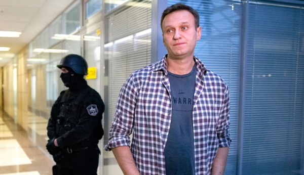 Putin critic Alexei Navalny able to leave bed as he recovers from poisoning