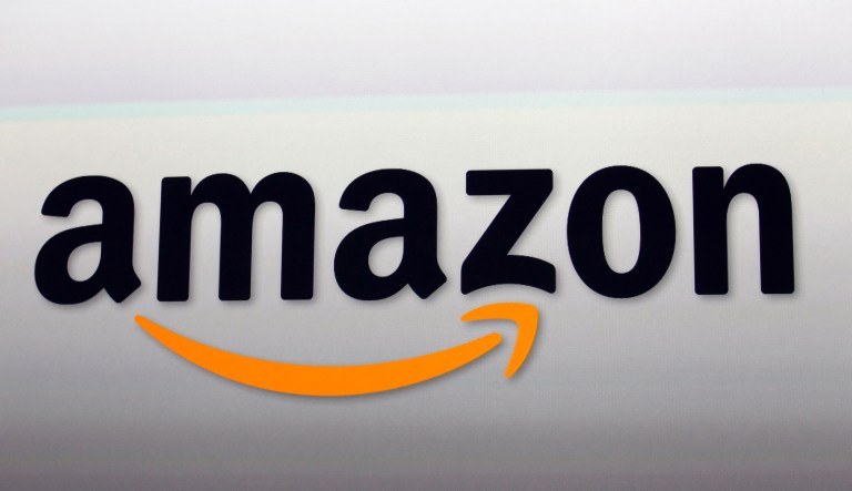 Amazon Prime Now bags full of groceries are loaded for delivery by a part-time worker outside a Whole Foods store, Thursday, Feb. 8, 2018, in Cincinnati.