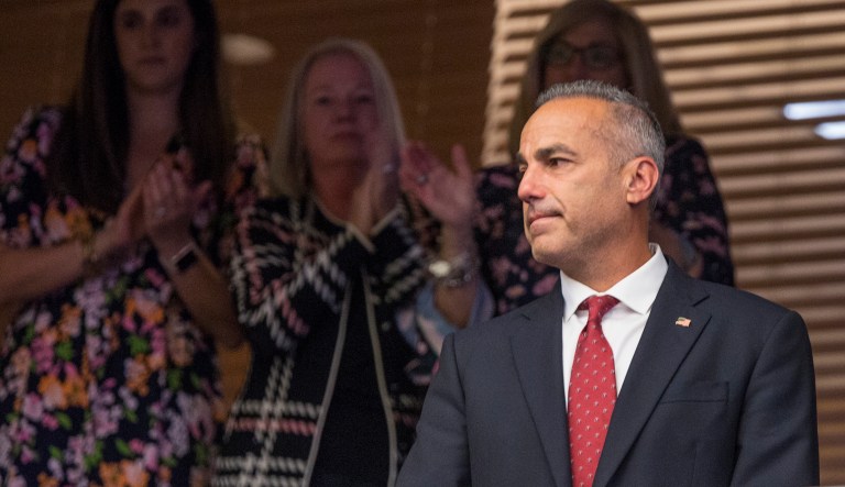 Andrew Pollack, father of 18 year-old school shooting victim Meadow Pollack, stands to applause in the Florida House gallery after the school safety bill passed the House 67-50 at the Florida Capitol in Tallahassee, Fla., Wednesday, March 7, 2018.