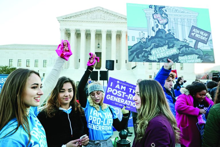 Protesters gather in front of the U.S. Supreme Court as the justices hear arguments in Dobbs v. Jackson Women's Health on December 01.