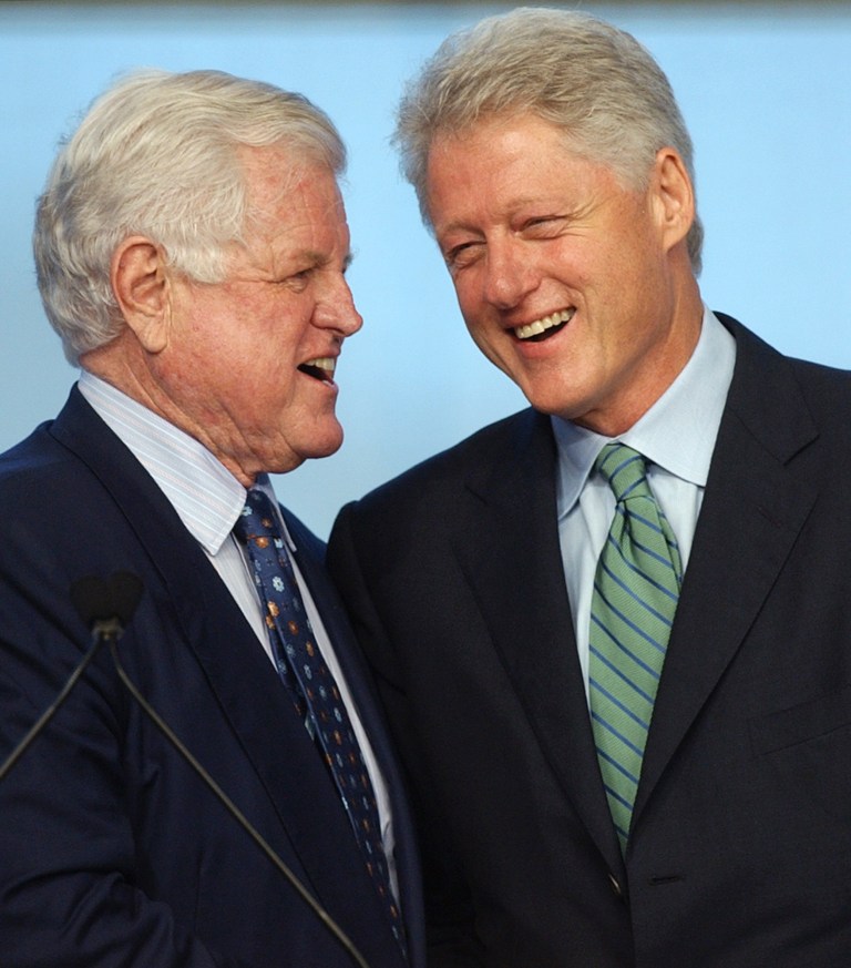 U.S. Sen. Edward M. Kennedy, D-Mass., left, and former President Bill Clinton laugh together as Kennedy introduces Clinton at the John F. Kennedy Library in Boston, Wednesday, May 28, 2003. Clinton addressed a crowd of several hundred during a forum called "A Conversation with President Clinton," moderated by historian Michael R. Beschloss.