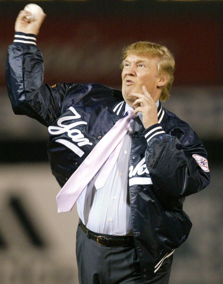 Businessman Donald Trump throws out the first pitch before the New York Yankees faced the Houston Astros, Friday, March 12, 2004, at Legends Field in Tampa, Fla.