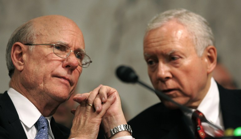 Senate Intelligence Committee Chairman Pat Roberts, R- Kan., talks with Sen. Orrin Hatch, R-Utah, during a hearing on Capitol Hill in Washington on May 18, 2006.