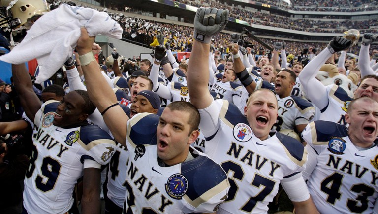 Midshipmen from the United States Naval Academy celebrate after the Army-Navy football game.