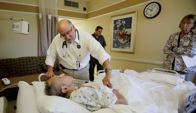 Dr. Joel Policzer checks on Walter Norton in this Oct. 30, 2009 photo, in the hospice wing of an Oakland Park, Fla. hospital. Most of Policzer's patients have made no end-of-life decisions.  Democrats in the U.S. House are trying to nudge more Americans to make their end-of-life decisions. 