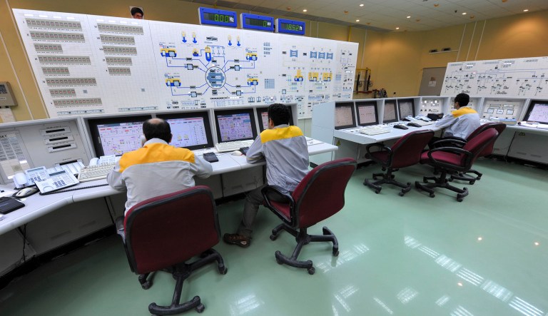 In this file photo Monday, Aug. 23, 2010, and released by the International Iran Photo Agency, Iranian technicians work at the Bushehr nuclear power plant, outside the southern city of Bushehr, Iran. In a major setback to Iran's nuclear program, technicians will have to unload fuel from the country's first atomic power plant because of an unspecified safety concern, a senior government official said.