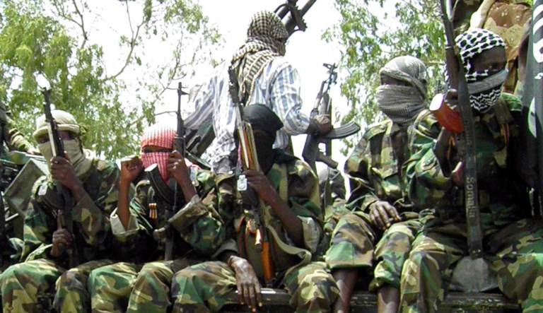 Al Shabab fighters display weapons as they conduct military exercises in northern Mogadishu, Somalia.