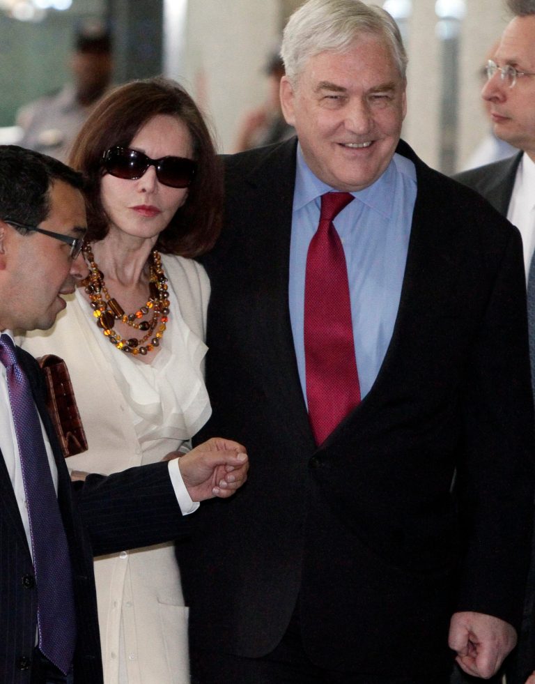 Conrad Black and his wife Barbara Amiel Black listen.