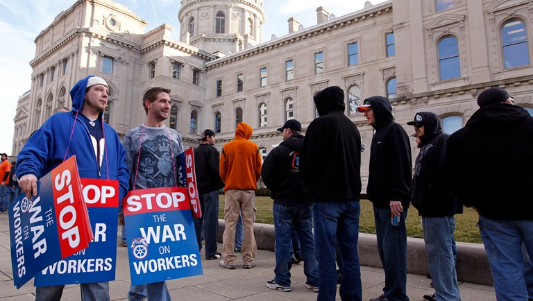 Union members protesting the right-to-work legislation wait to enter the Statehouse in Indianapolis.