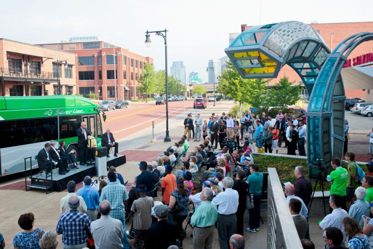 People gather for a ceremony at Rapid Central Station for the BRT (Bus Rapid Transit) Silver Line in Grand Rapids, Mich., Monday, Aug. 25 2014.  The 9.6-mile Silver Line Bus Rapid Transit system will kick off this week with free rides to attract commuters, the Grand Rapids Press reported. The federal government paid about $32 million of the costs, and the state paid almost $8 million. (AP Photo/The Grand Rapids Press, Joel Bissell) ALL LOCAL TELEVISION OUT; LOCAL TELEVISION INTERNET OUT