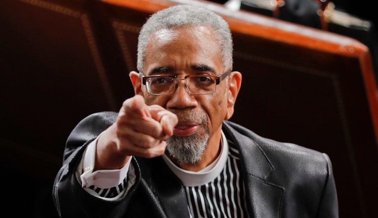 Rep. Bobby Rush, D-Ill., points to guests in the balcony as he takes his seat on Capitol Hill in Washington. 