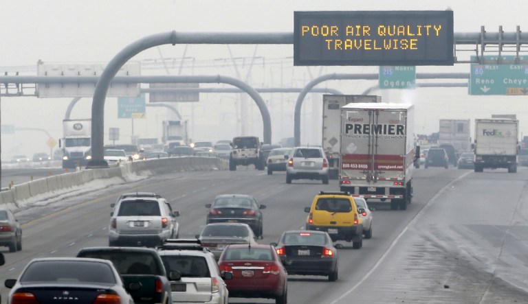 A poor air quality sign is posted over a highway in Salt Lake City.