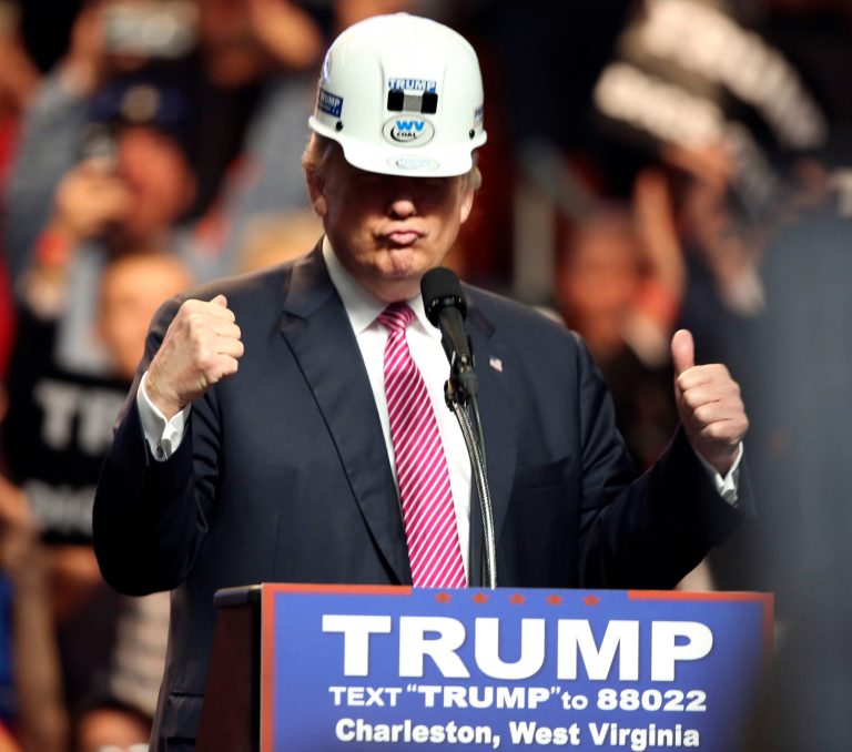 Republican presidential candidate Donald Trump puts on a miners hard hat during a rally in Charleston, W.Va., Thursday, May 5, 2016.