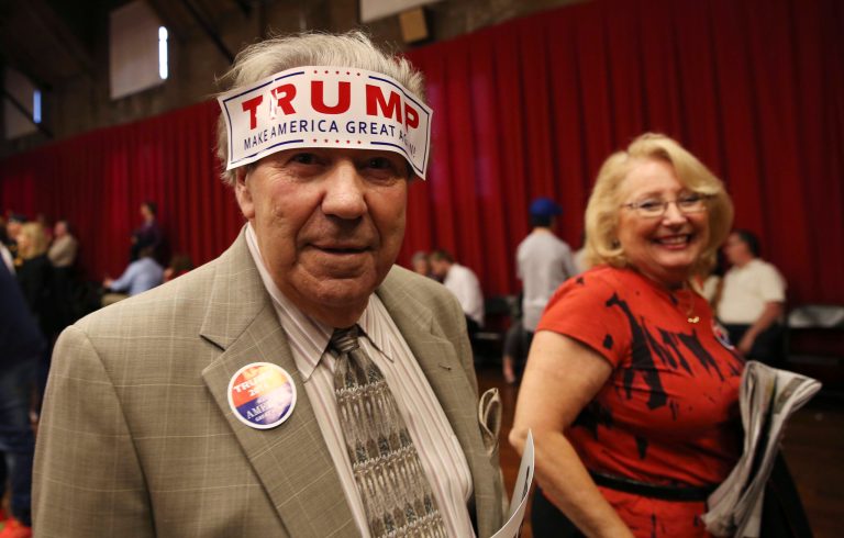 A supporter wears a bumper sticker on his forehead after Republican presidential candidate Donald Trump spoke at a campaign event Thursday, May 19, 2016, in Lawrenceville, N.J.