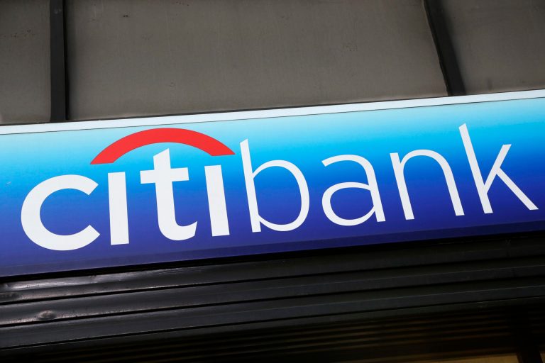 In this 2015 photo, a Citibank sign hangs above a branch office in New York.