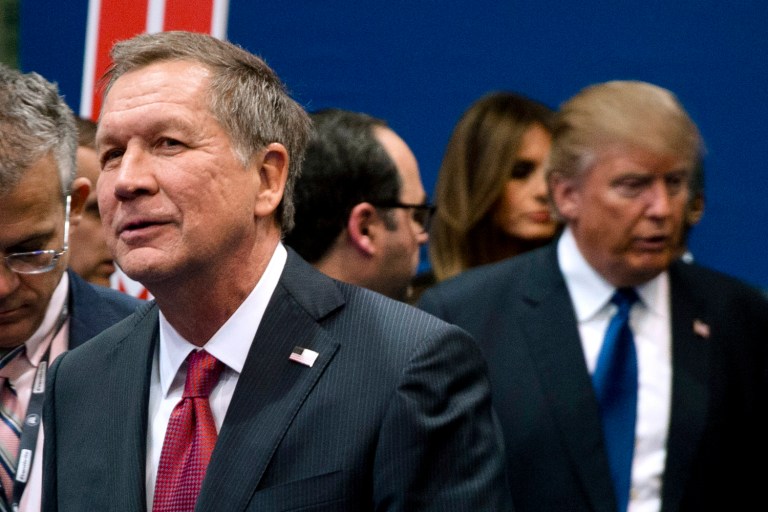 In this Feb. 6, 2016, file photo, Ohio Gov. John Kasich, left, and Donald Trump, right, speak to reporters after a Republican presidential primary debate hosted by ABC News at Saint Anselm College in Manchester, N.H.